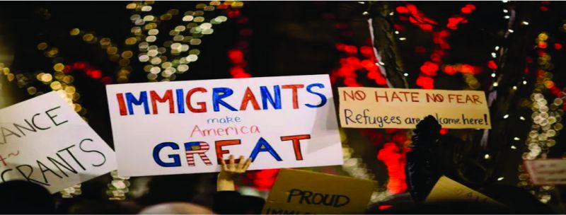 Cartazes em manifestação a favor de imigrantes e refugiados nos EUA